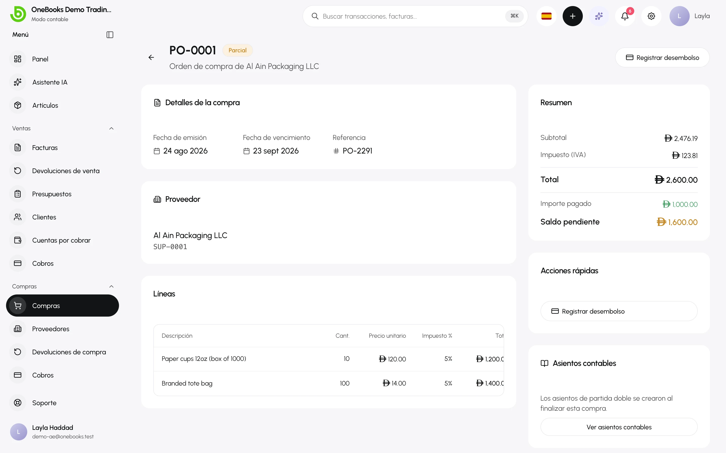 Una compra recibida con el importe pagado, el saldo pendiente, Registrar desembolso y Ver asientos contables
